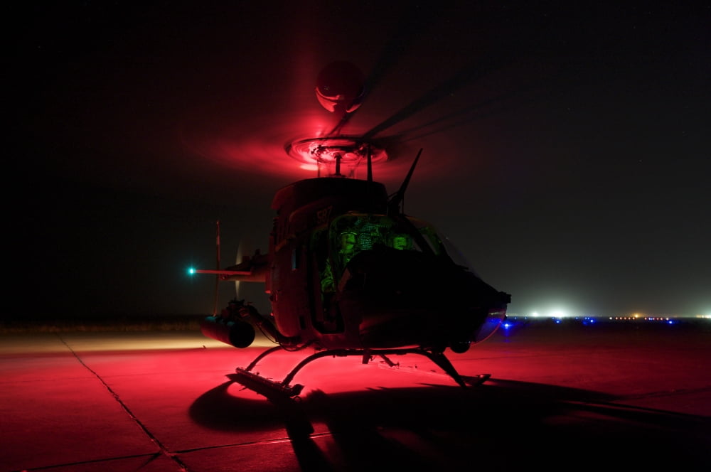 Pilots prepare for takeoff in an OH-58D Kiowa Warrior Canvas Art - Terry MooreStocktrek Images (18 x 12)