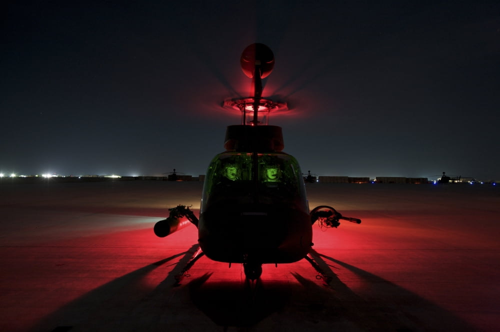 Pilots prepare for takeoff in an OH-58D Kiowa Warrior on Camp Speicher Iraq Canvas Art - Terry MooreStocktrek Images (35 x 23)
