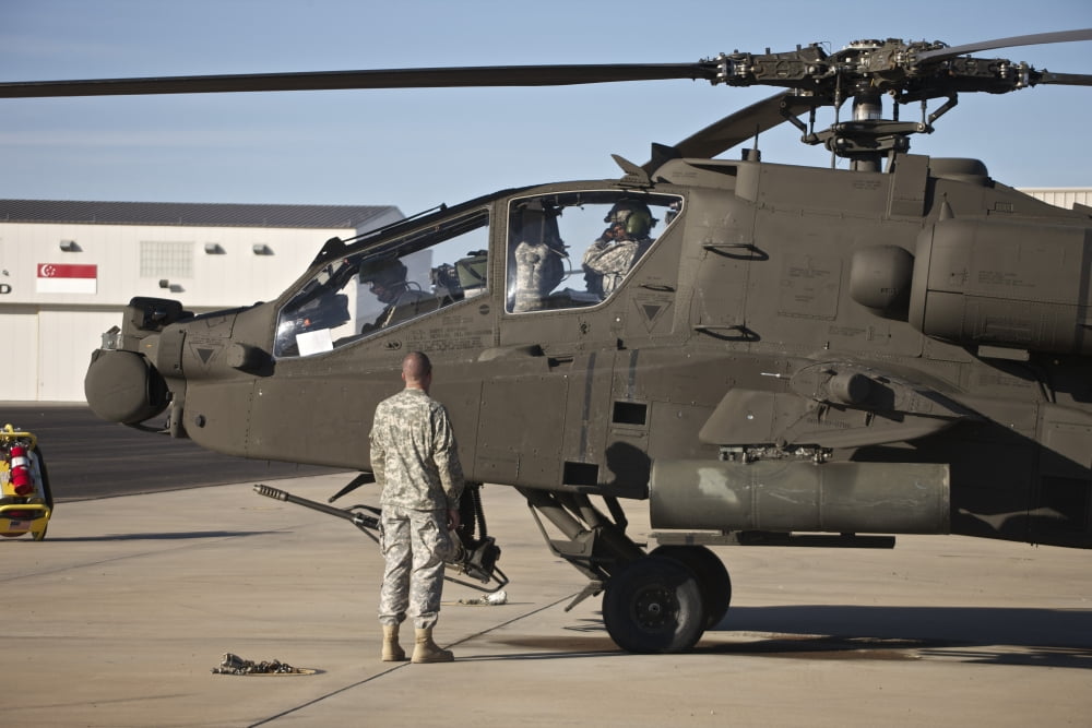 Pilots prepare for their mission in an AH-64D Apache Longbow Canvas Art - Terry MooreStocktrek Images (18 x 12)