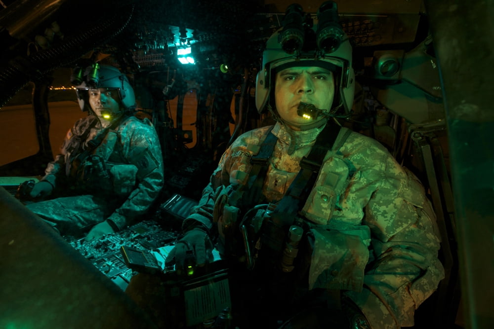 Pilots sitting in the cockpit of a UH-60 Black Hawk helicopter Canvas Art - Terry MooreStocktrek Images (18 x 12)