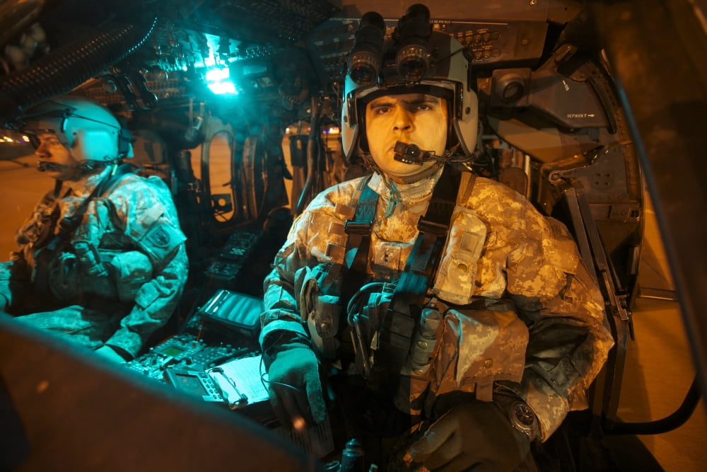 Pilots sitting in the cockpit of a UH-60 Black Hawk helicopter Canvas Art - Terry MooreStocktrek Images (35 x 23)