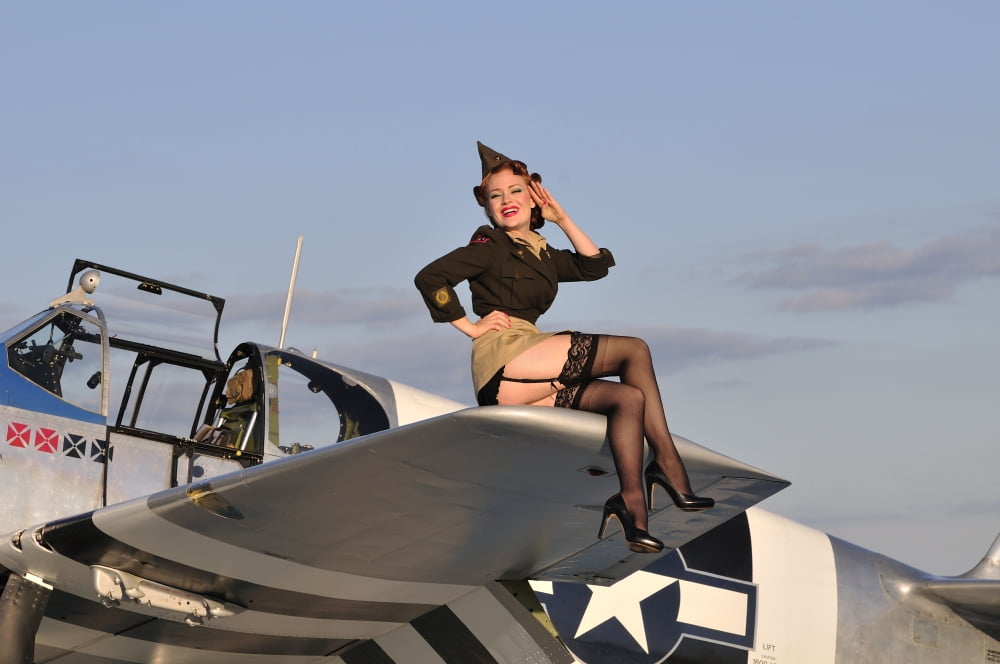Pin-up girl sitting on the wing of a P-51 Mustang Canvas Art - Christian KiefferStocktrek Images (35 x 23)