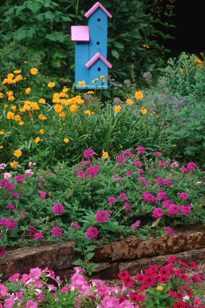 Pink and blue birdhouses in flower garden Marion County Illinois USA Canvas Art - Panoramic Images (24 x 36)