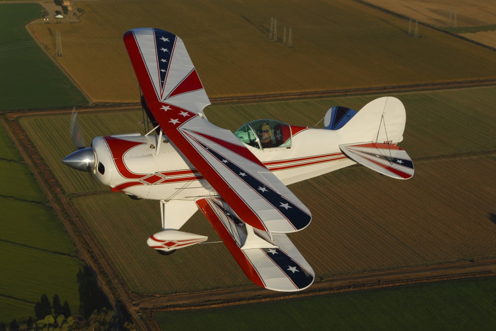 Pitts S-2A biplane flying over Vacaville California Canvas Art - Phil WallickStocktrek Images (34 x 23)