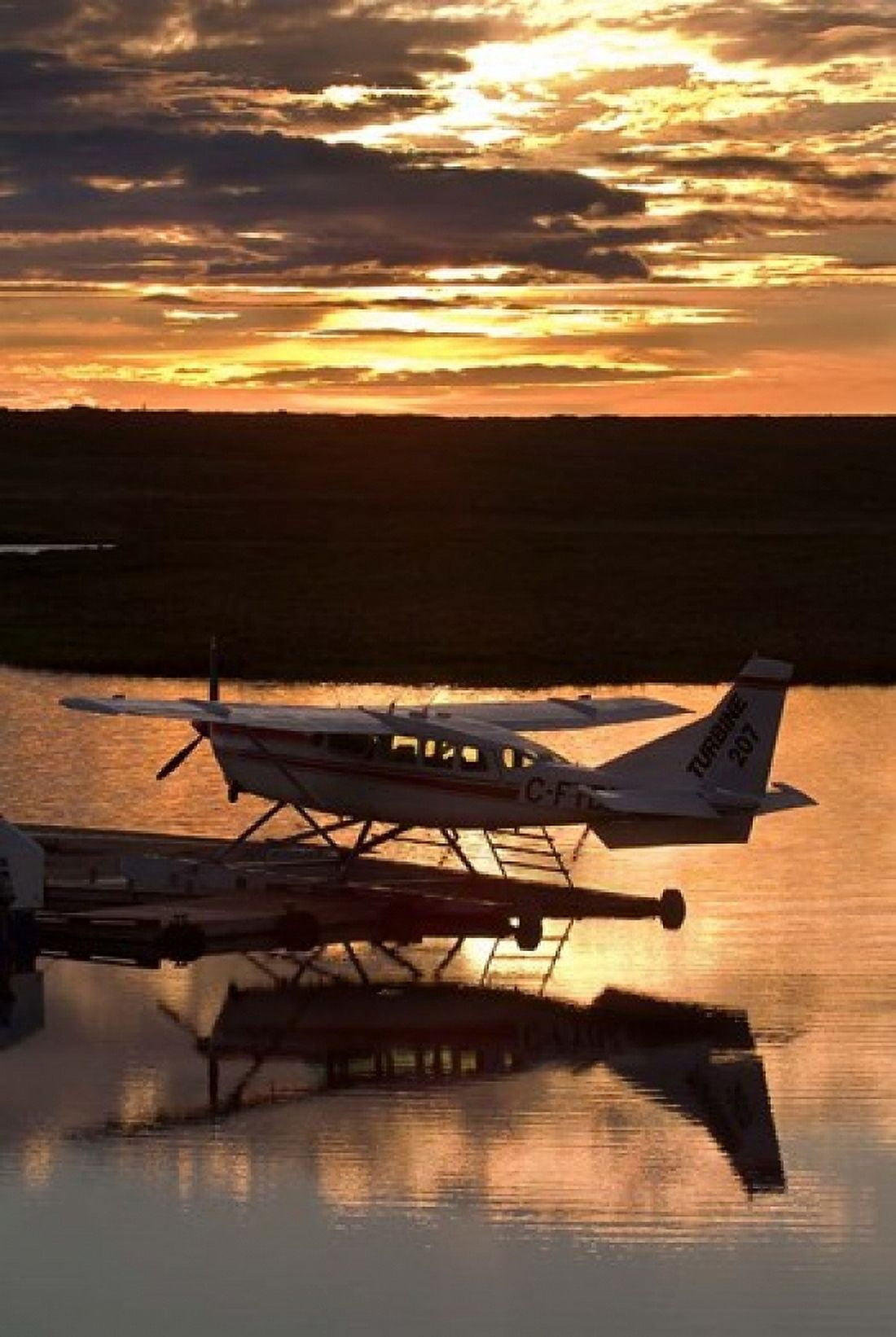 Plane on Whitefish Lake Canvas Art - Janis Miglavs DanitaDelimont (18 x 26)