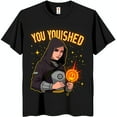 thumbnail image 1 of Playful Cartoon Graphic Black T-Shirt: 'You Youshed' with Fiery Design & Starry Background, 1 of 5