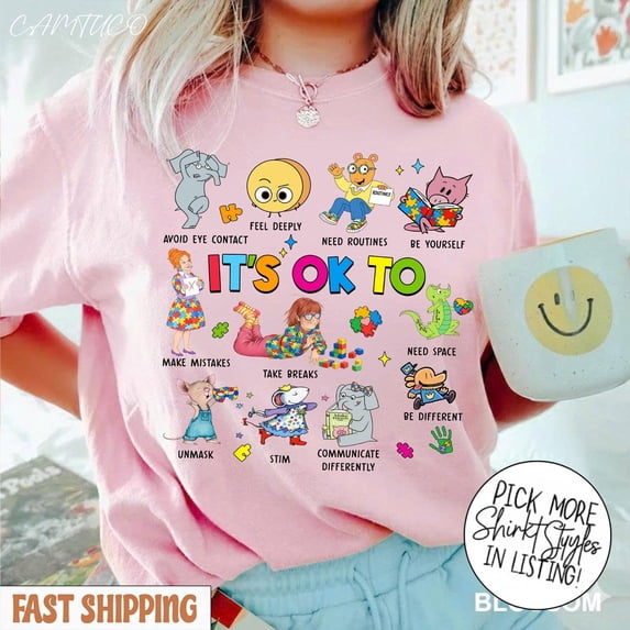 Playful Cartoon Graphic T-Shirt - It's Ok To Be Different, Promoting Self-Acceptance and Positivity