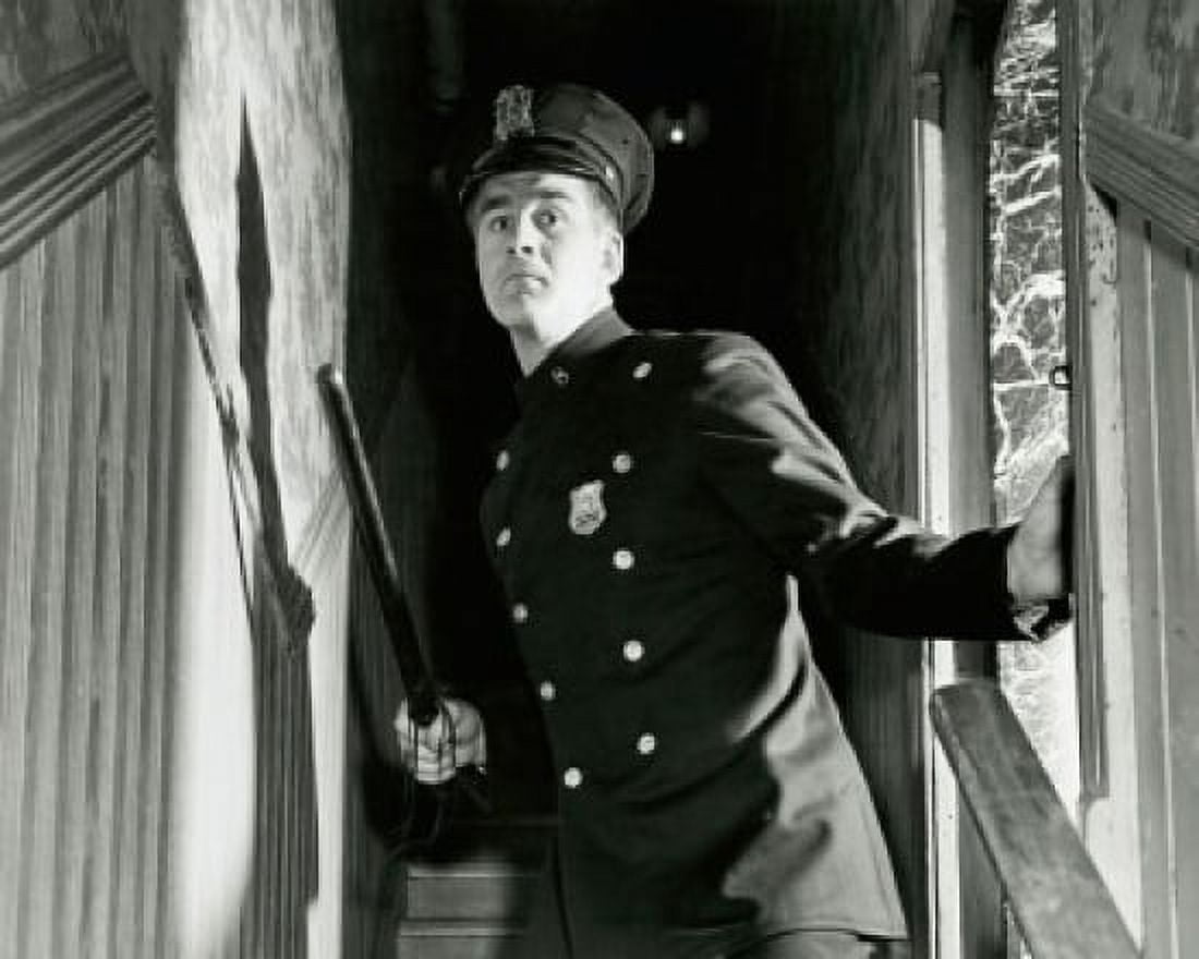 Policeman holding a nightstick and standing on staircase Canvas Art - (24 x 36)