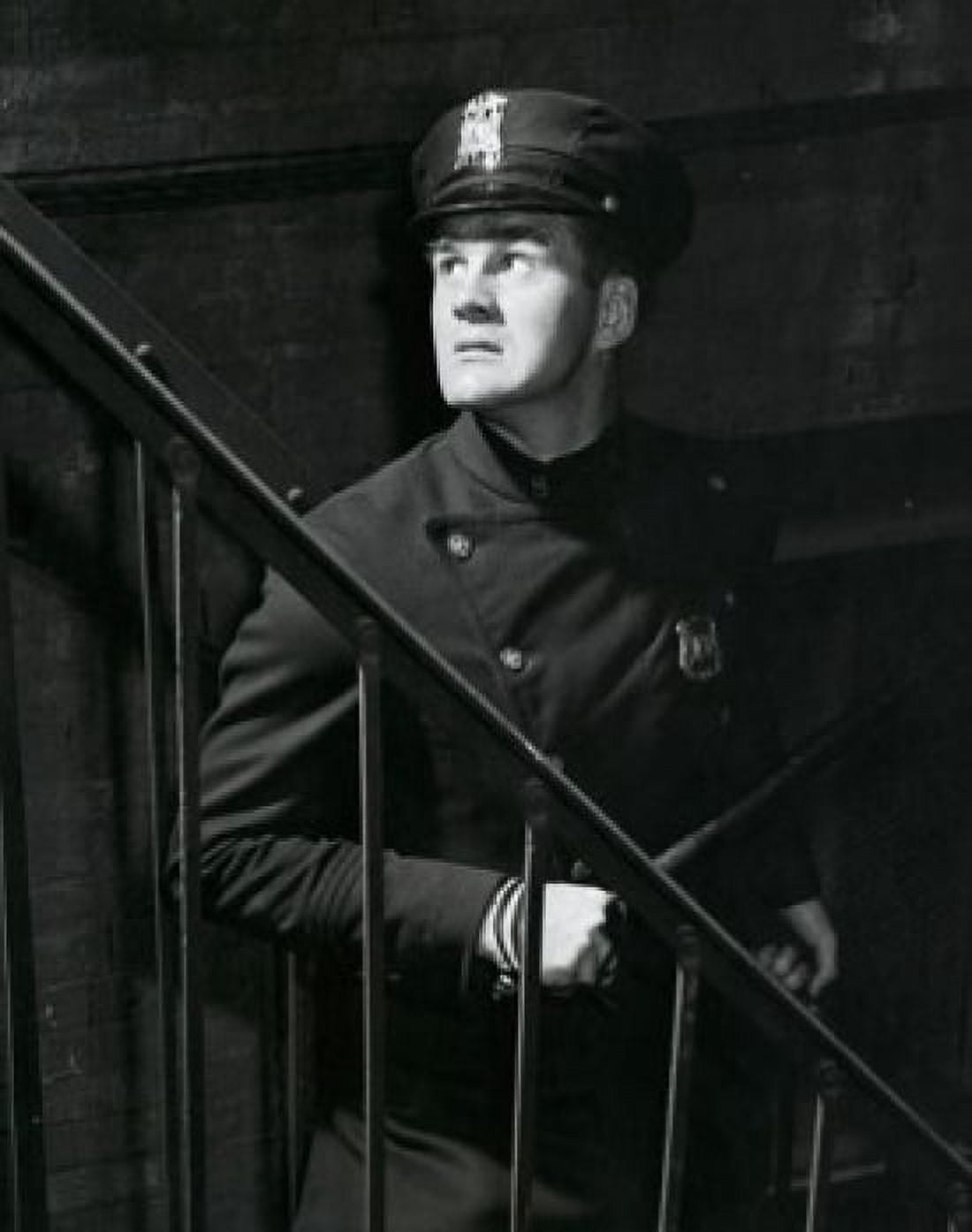 Policeman standing near a staircase Canvas Art - (18 x 24)