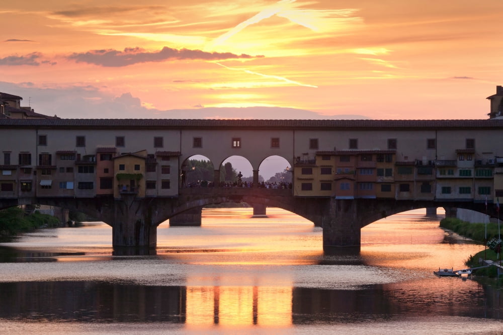 Ponte Vecchio bridge at sunset Arno River Florence Tuscany Italy Canvas Art - Panoramic Images (27 x 9)
