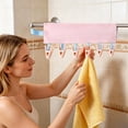 thumbnail image 1 of Portable Hanging Clothes Pegs, Foldable Travel Clothesline with 6 Clips for Socks & Underwear, 1 of 4