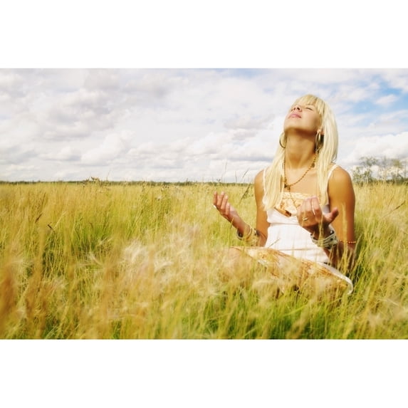 Portrait Of Woman Praying In Field Poster Print by Don Hammond / Design Pics (17 x 11)