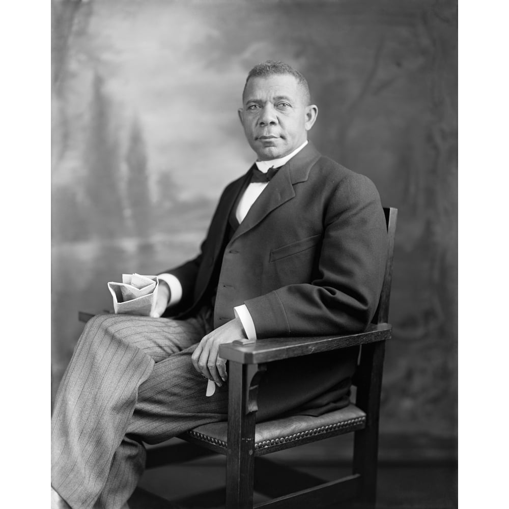 Portrait of Booker T. Washington sitting in a chair Poster Print