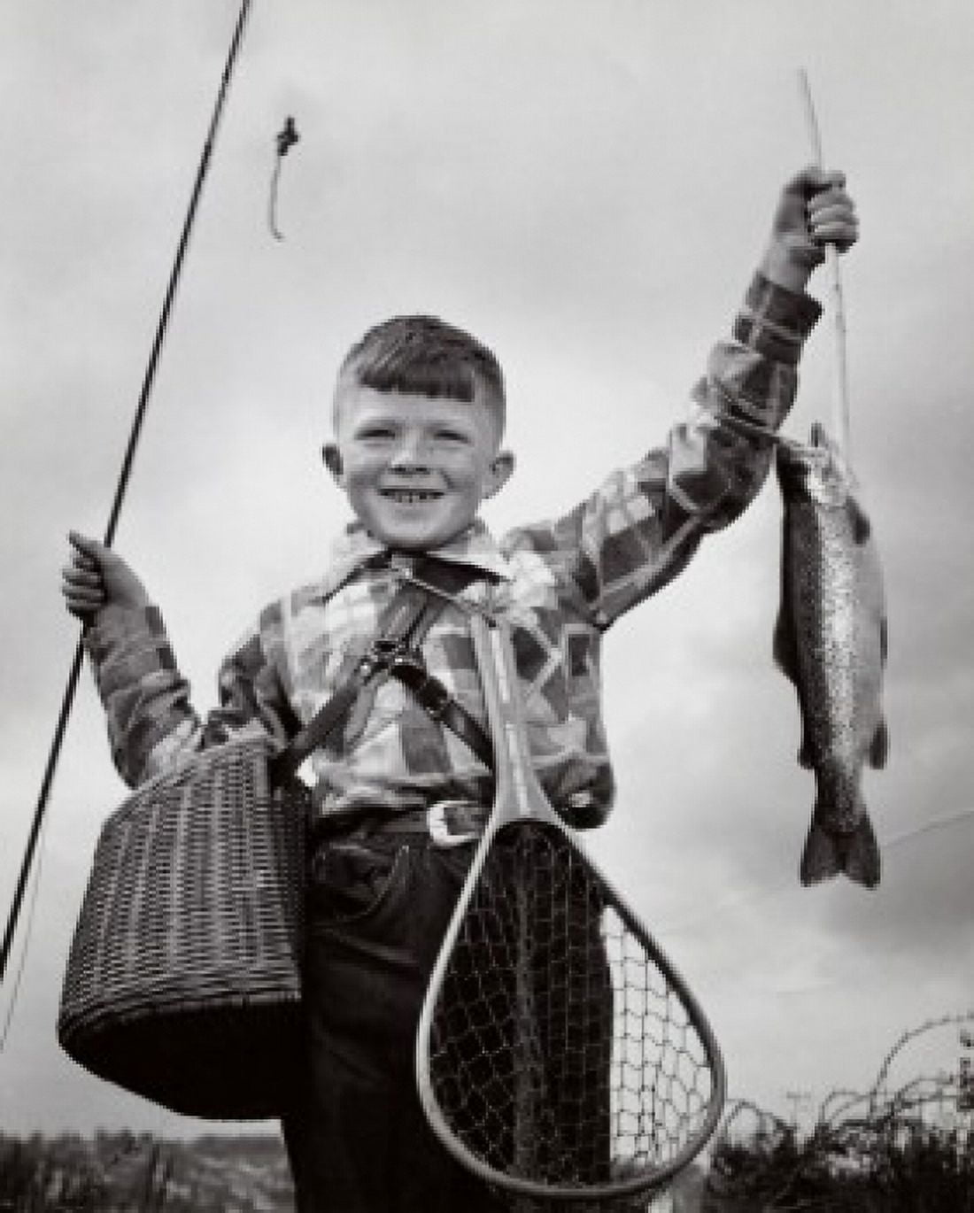 Portrait of a boy holding a dead fish and a fishing pole Canvas Art - (18 x 24)