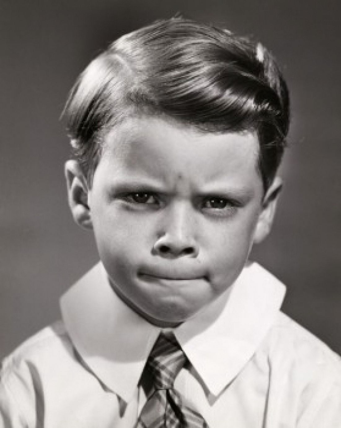 Portrait of a boy looking upset Canvas Art - (18 x 24)