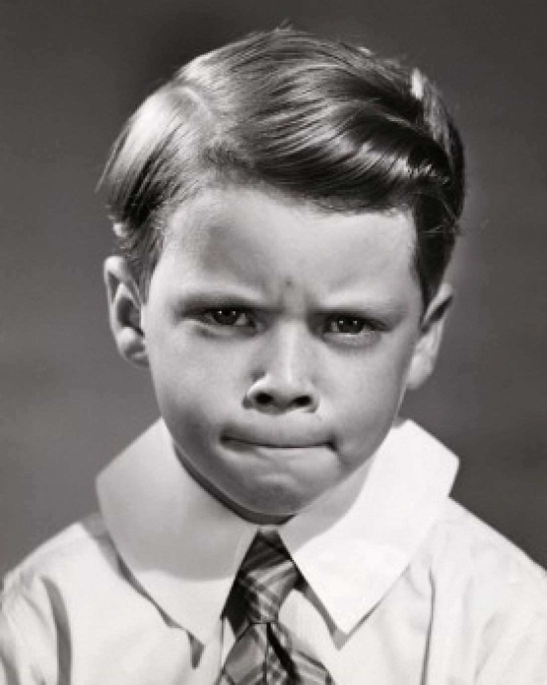 Portrait of a boy looking upset Canvas Art - (24 x 36)
