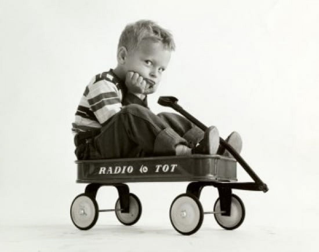 Portrait of a boy sitting in a wagon Canvas Art - (18 x 24)