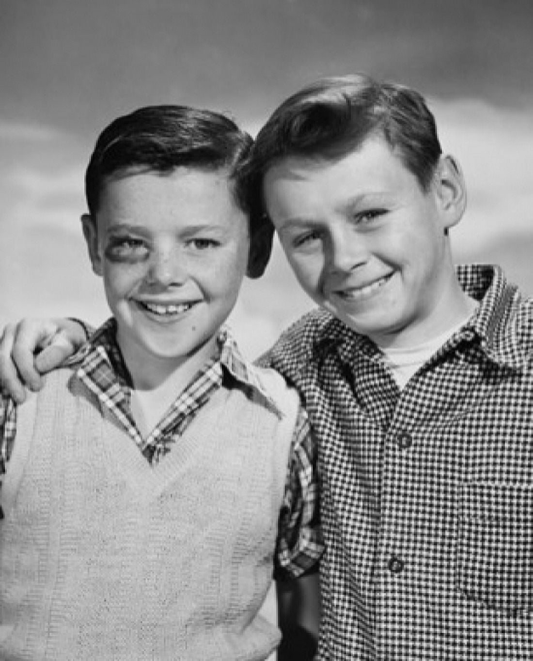 Portrait of a boy with a black eye smiling with another boy standing beside him Canvas Art - (24 x 36)