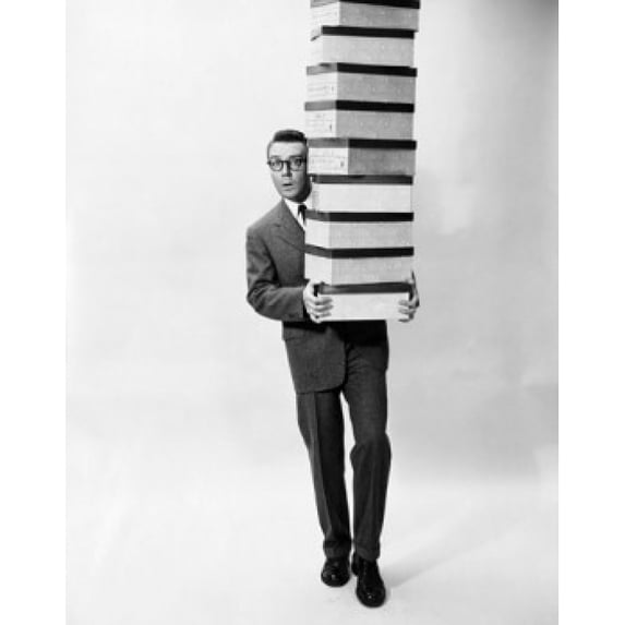 Portrait of a businessman carrying a stack of boxes Poster Print (24 x 36)