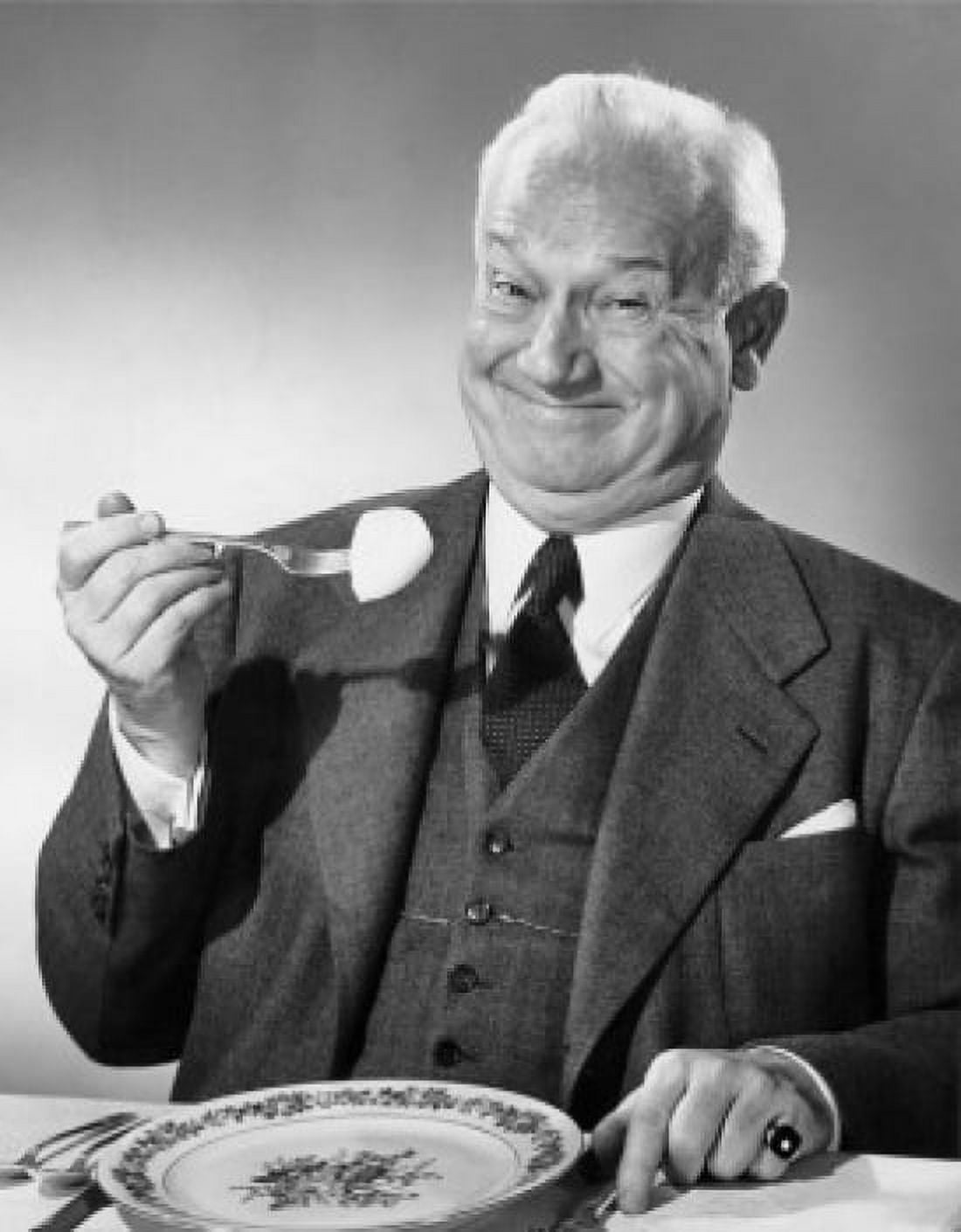 Portrait of a businessman eating food Canvas Art - (18 x 24)