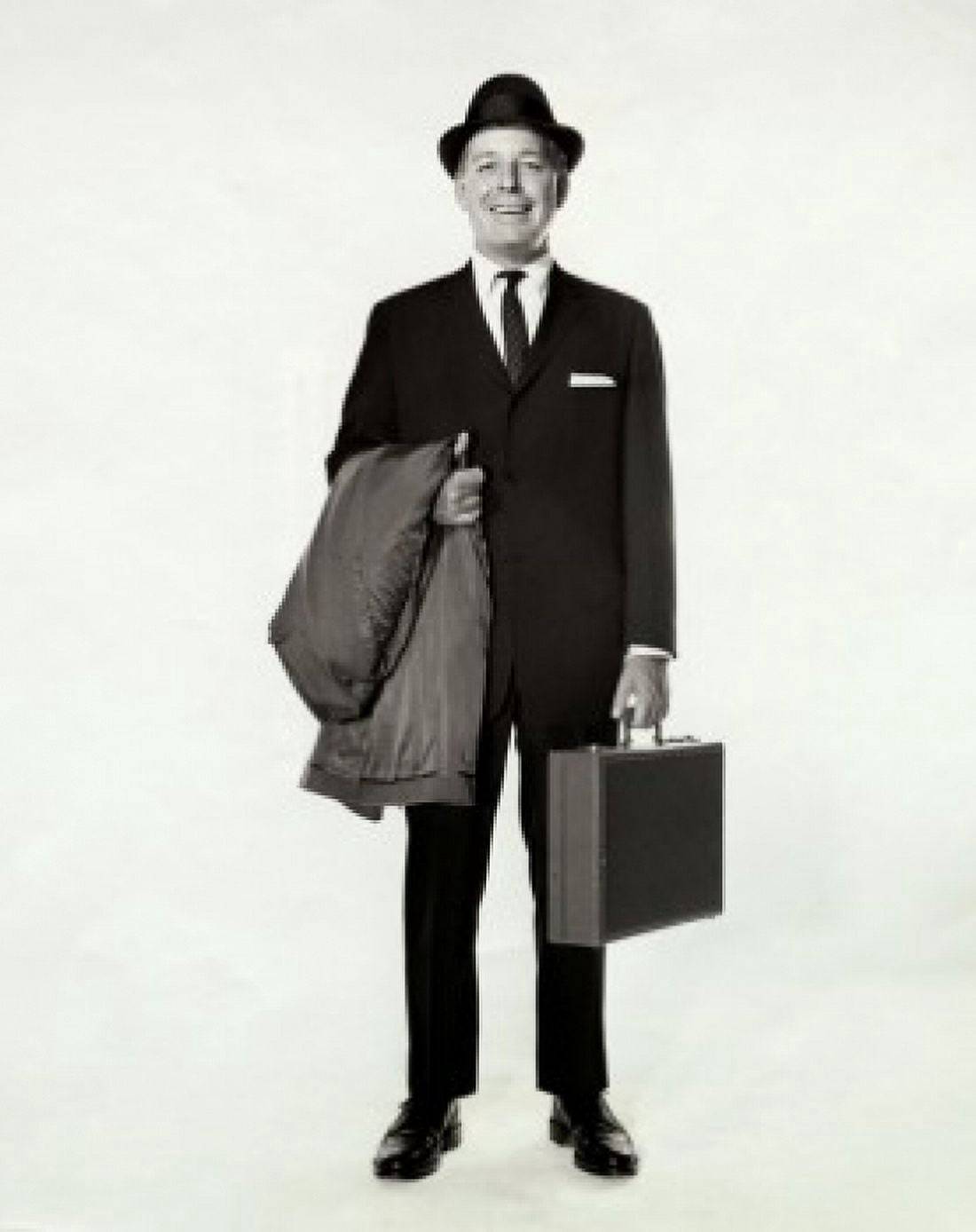 Portrait of a businessman holding a briefcase and an overcoat Canvas Art - (18 x 24)