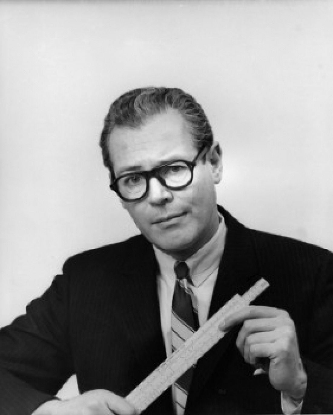 Portrait of a businessman holding a slide rule Canvas Art - (24 x 36)