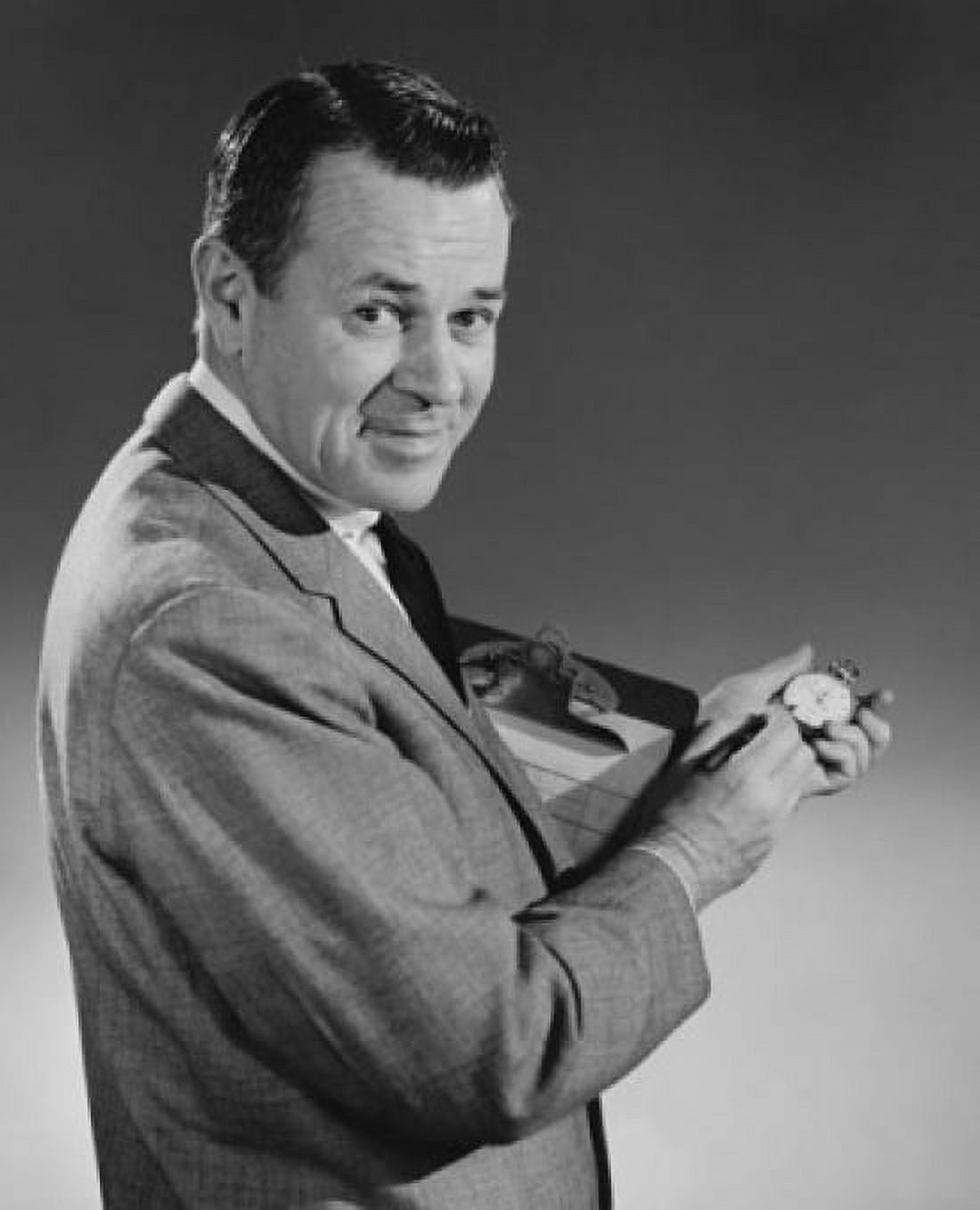 Portrait of a businessman holding a stopwatch and a clipboard Canvas Art - (18 x 24)