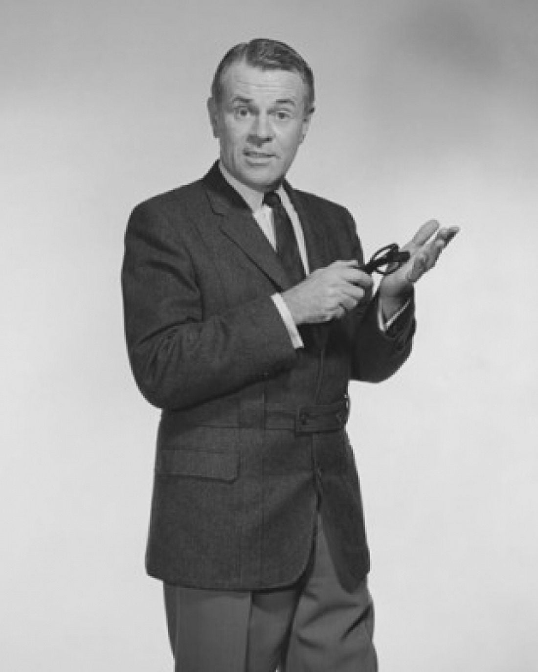 Portrait of a businessman holding his eyeglasses Canvas Art - (24 x 36)