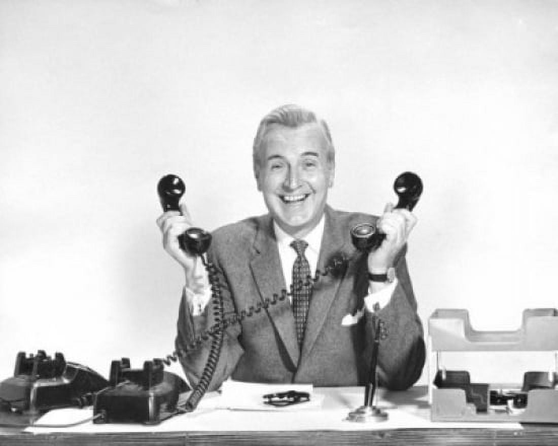 Portrait of a businessman holding two telephone receivers Canvas Art - (24 x 36)