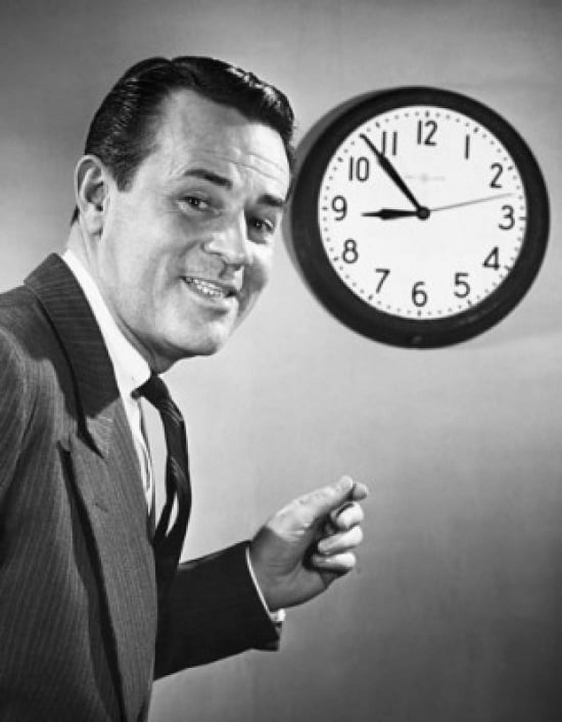Portrait of a businessman in front of a clock smiling Canvas Art - (18 x 24)