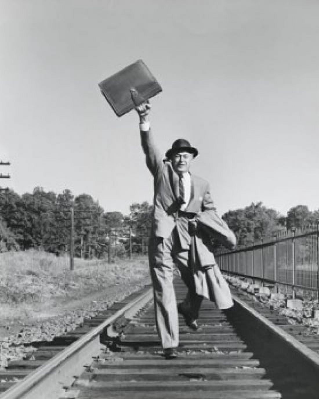 Portrait of a businessman running on railroad tracks Canvas Art - (18 x 24)