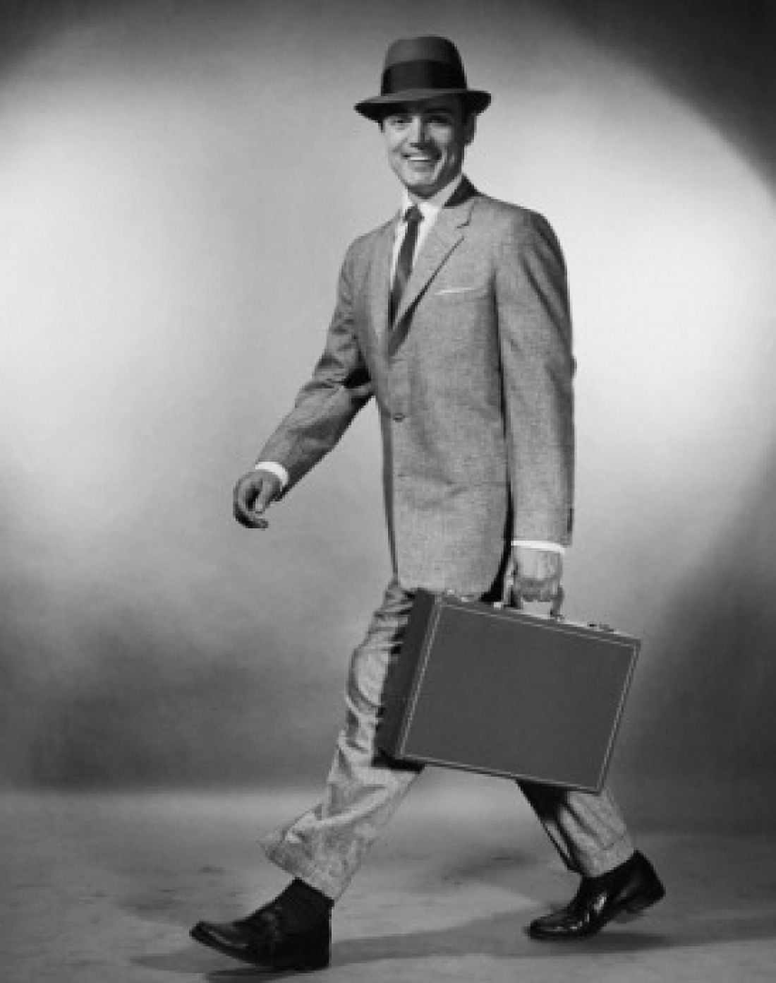 Portrait of a businessman walking carrying a briefcase Canvas Art - (18 x 24)