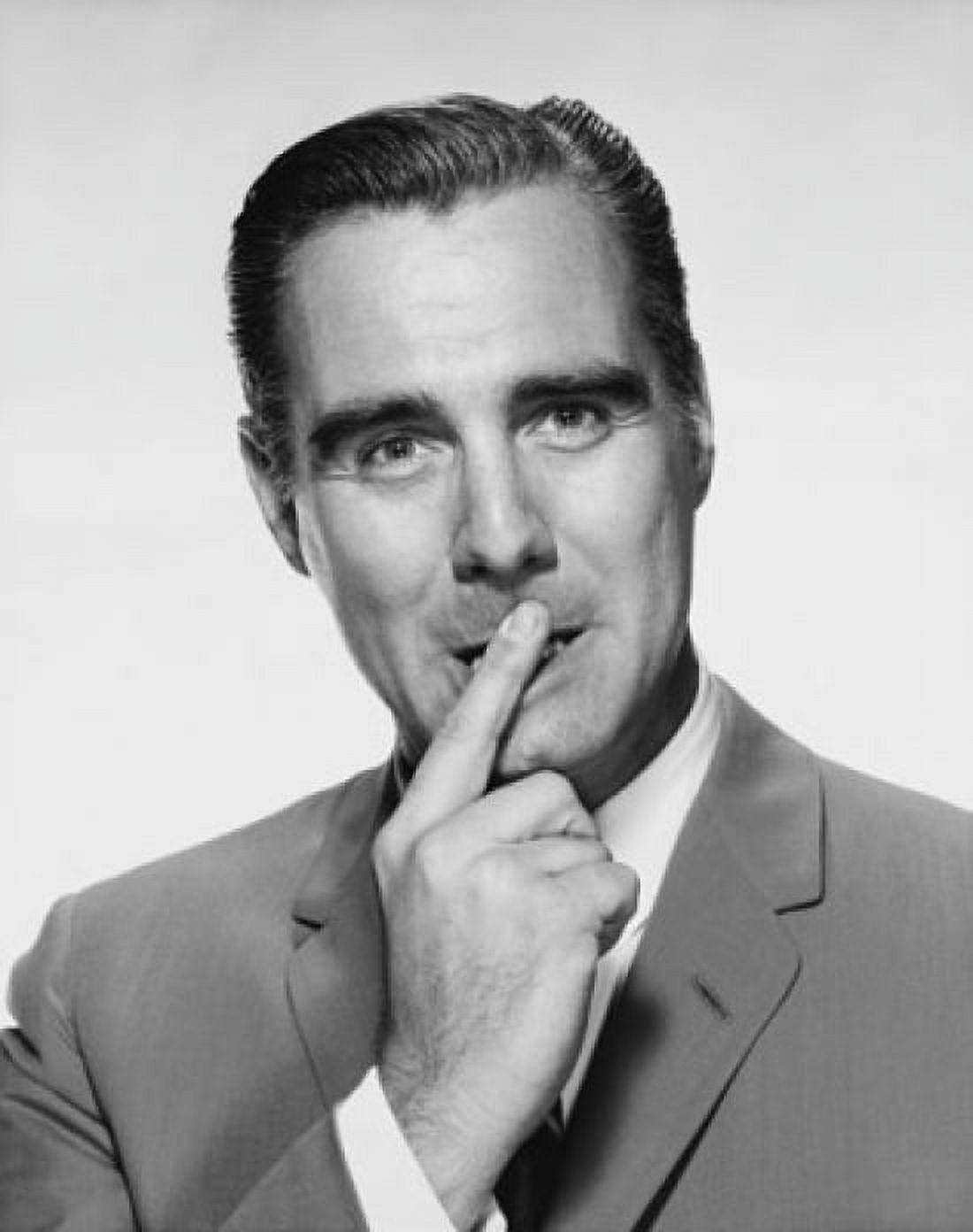 Portrait of a businessman with his finger on his lips Canvas Art - (24 x 36)