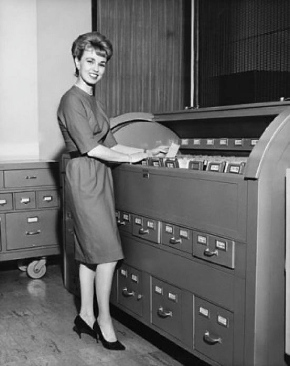 Portrait of a businesswoman holding a document beside a filing cabinets Canvas Art - (18 x 24)