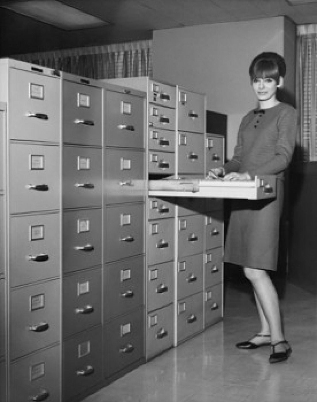 Portrait of a businesswoman holding a document beside a filing cabinets Canvas Art - (24 x 36)