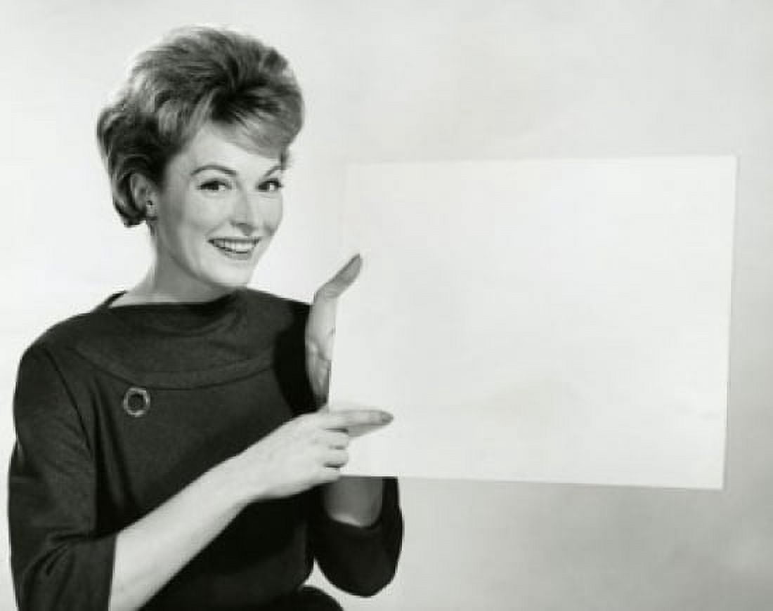 Portrait of a businesswoman pointing at a blank placard Canvas Art - (18 x 24)