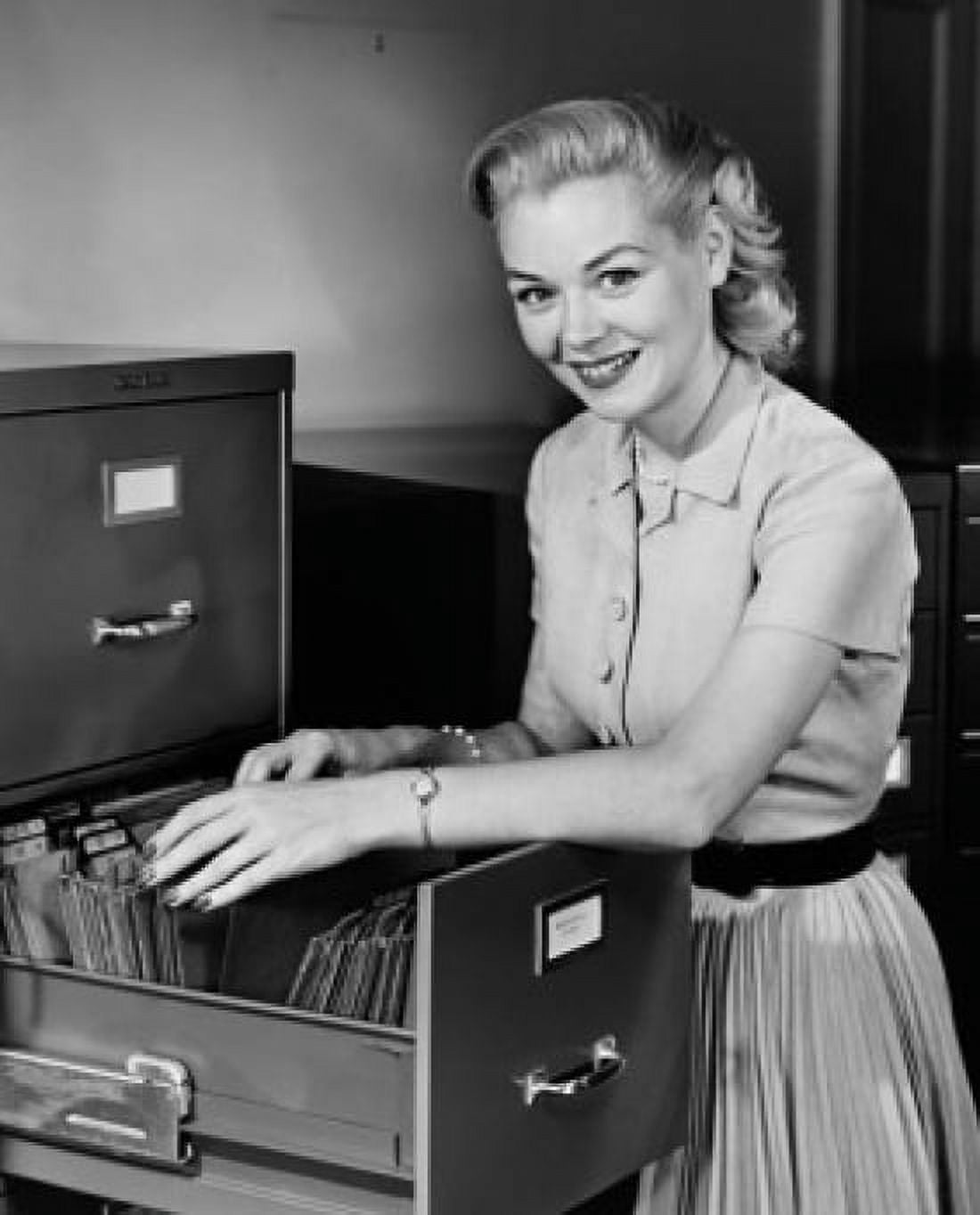 Portrait of a businesswoman searching for files in a filing cabinet Canvas Art - (18 x 24)