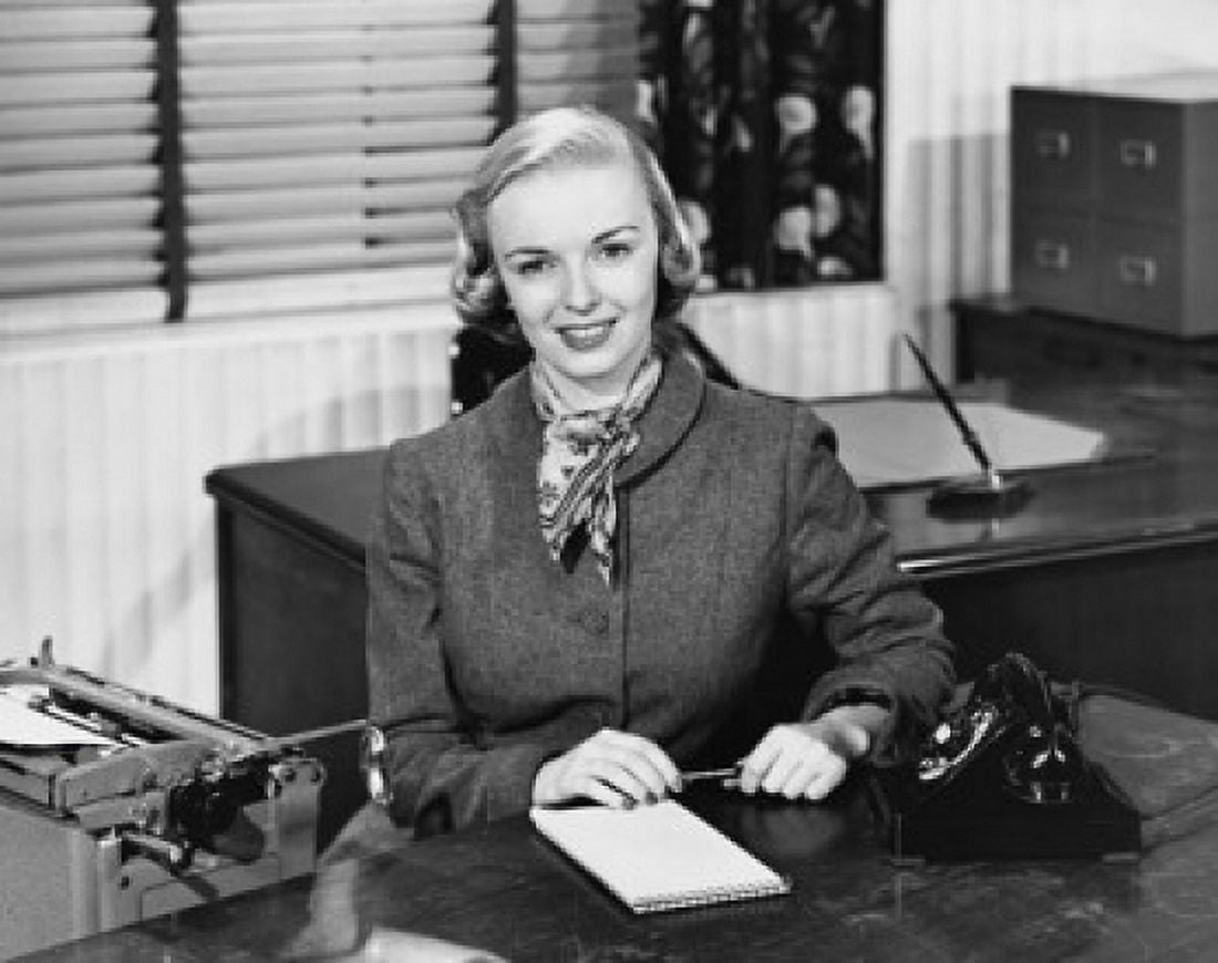 Portrait of a businesswoman sitting at a desk and smiling in an office Canvas Art - (24 x 36)