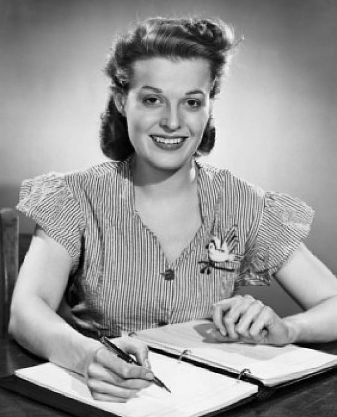 Portrait of a businesswoman writing in a notebook and smiling Canvas Art - (24 x 36)