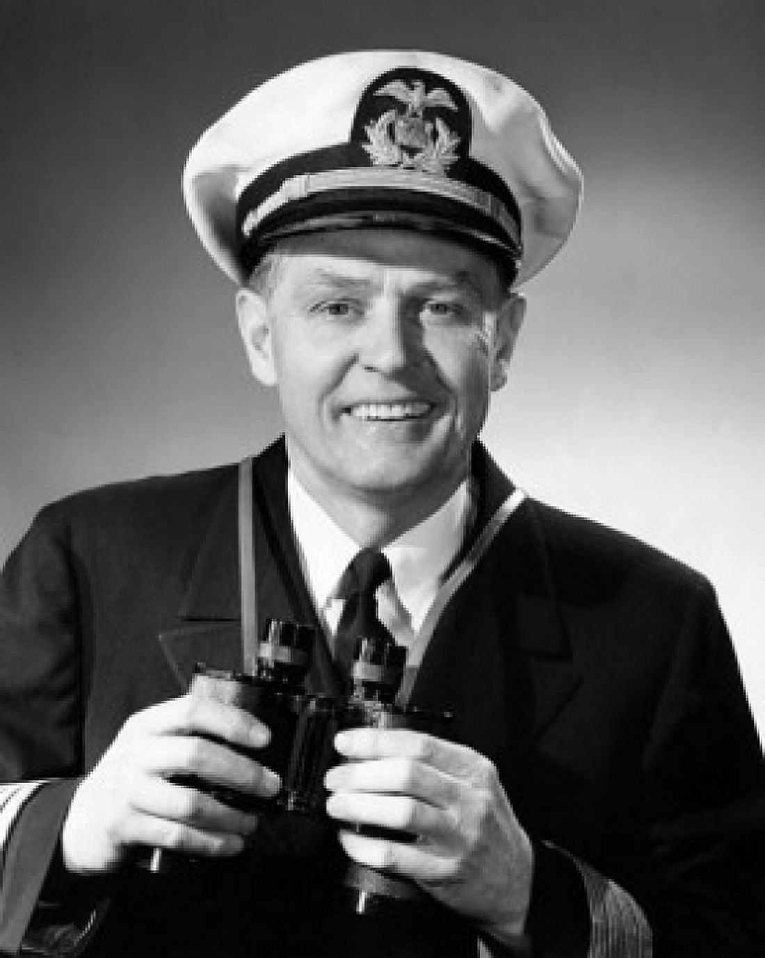 Portrait of a captain holding a pair of binoculars and smiling Canvas Art - (18 x 24)