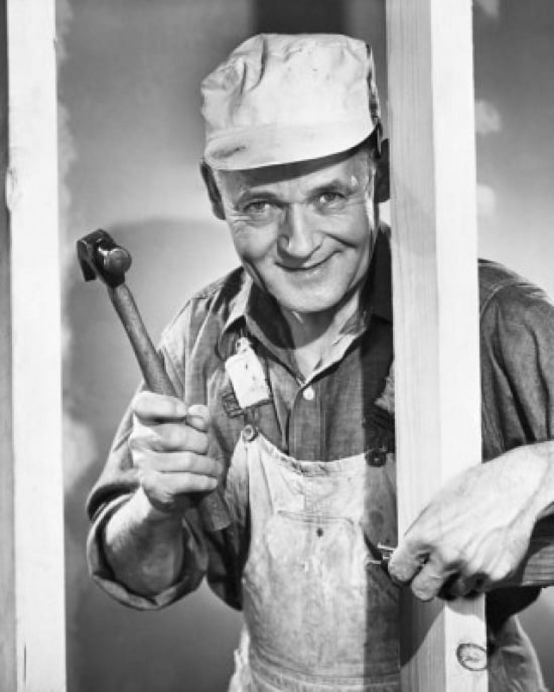 Portrait of a carpenter hammering a nail into a plank Canvas Art -  (24 x 36)