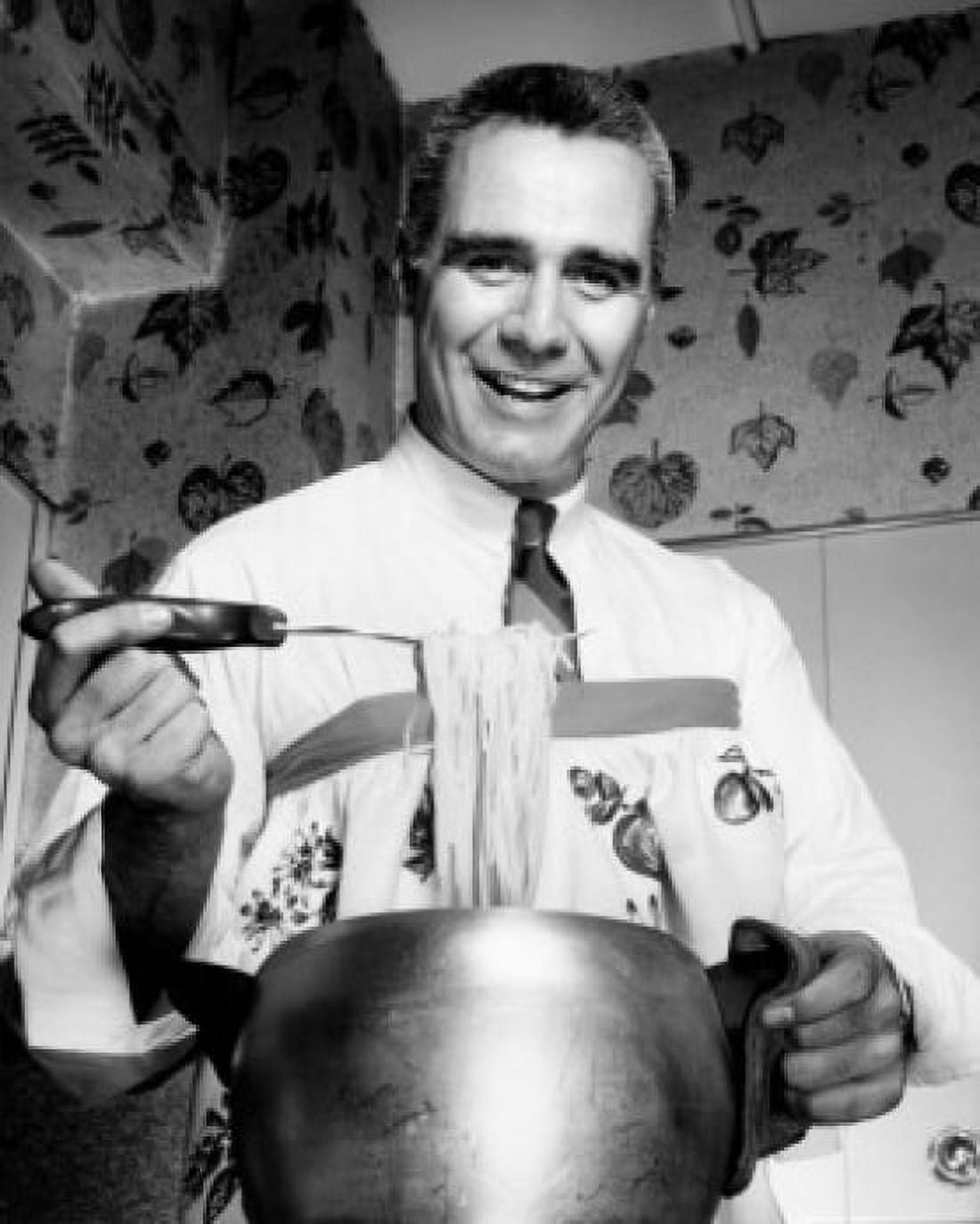 Portrait of a chef holding cooked spaghetti using a fork Canvas Art - (24 x 36)