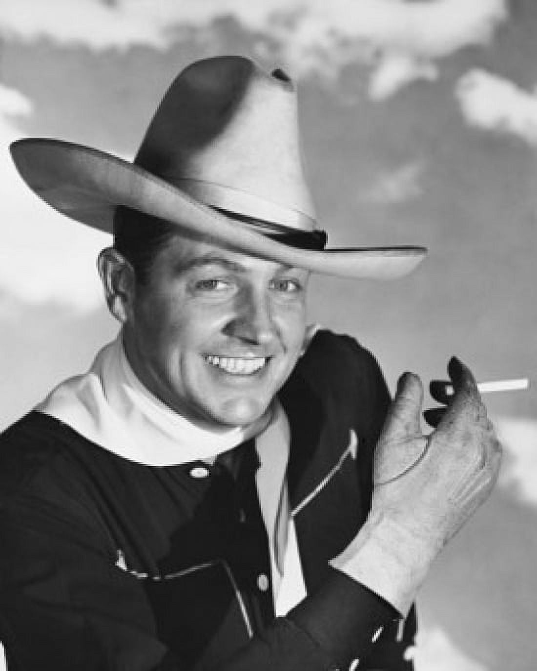Portrait of a cowboy holding a cigarette smiling Canvas Art -  (24 x 36)