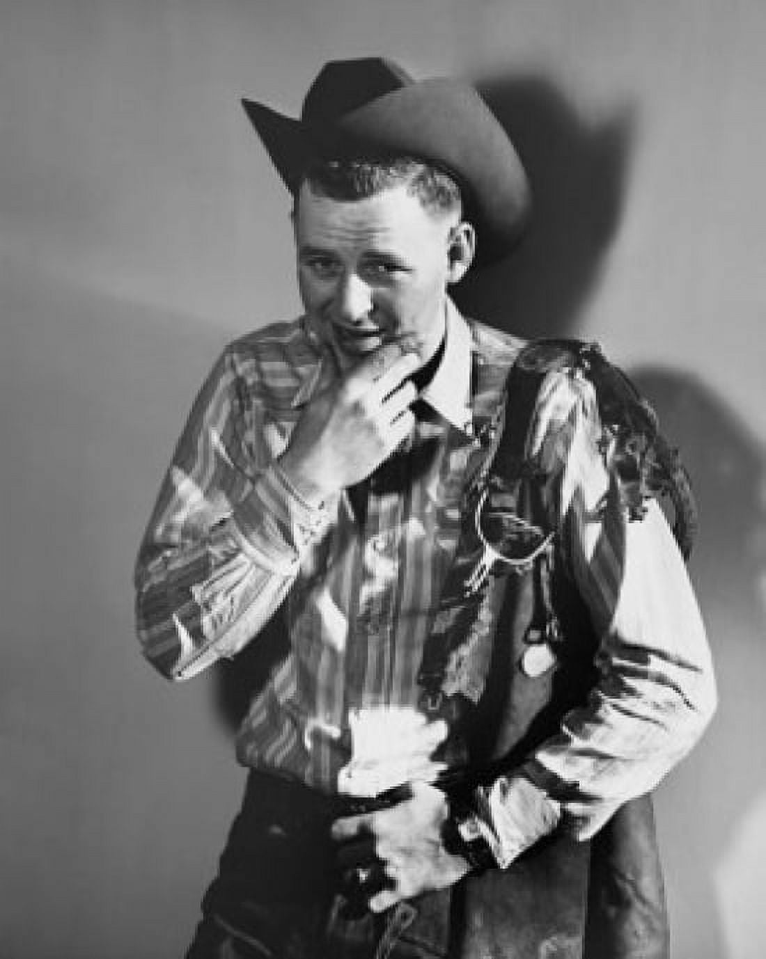 Portrait of a cowboy with a saddle on his shoulder Canvas Art - (18 x 24)