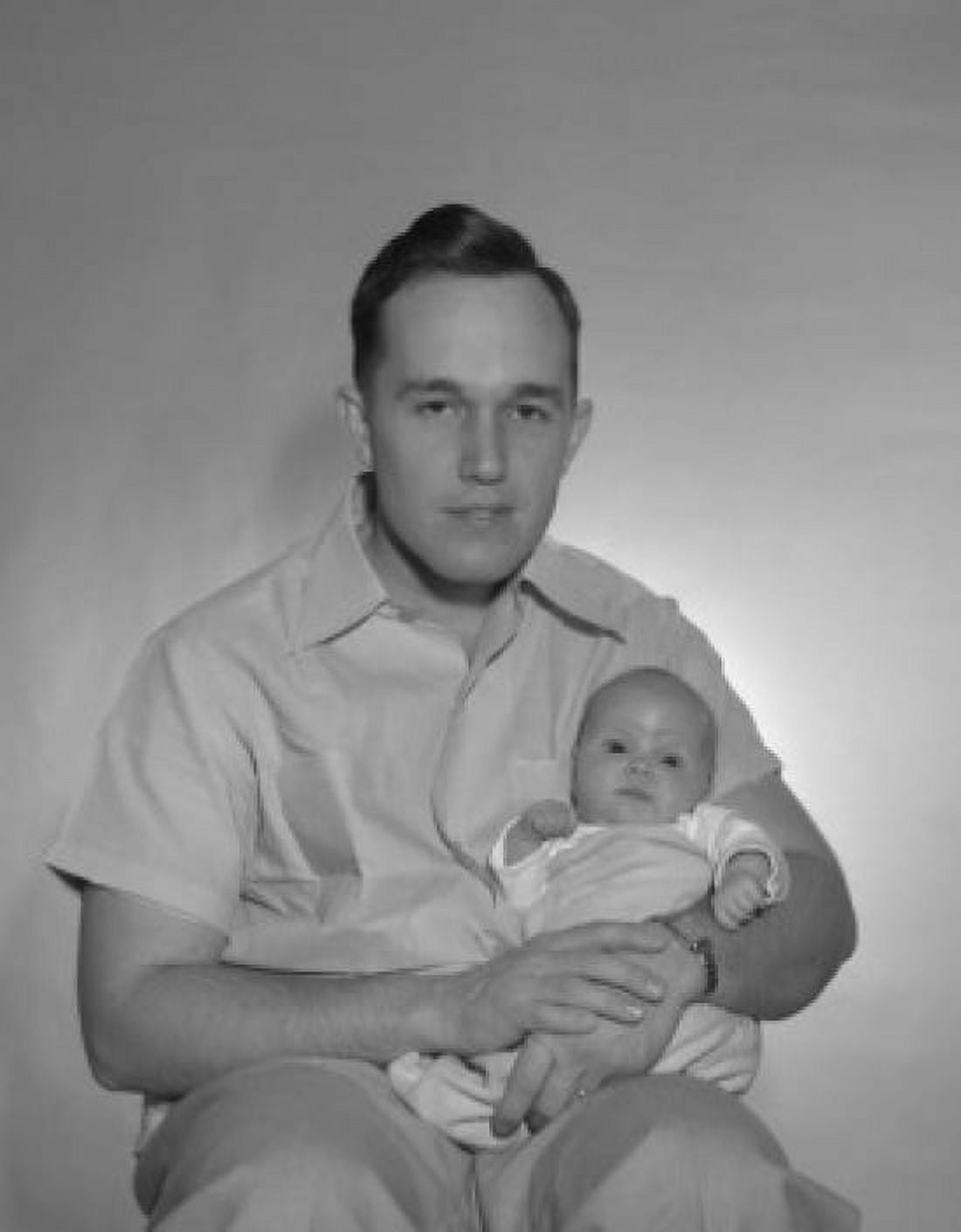 Portrait of a father holding his baby Canvas Art - (24 x 36)