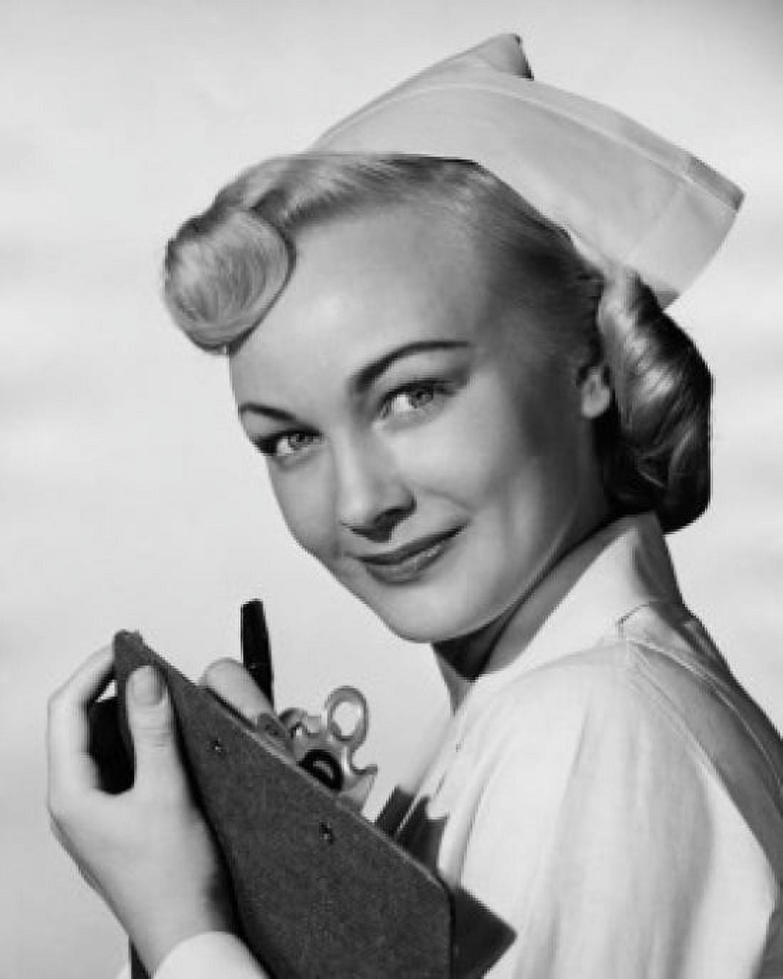 Portrait of a female nurse holding a clipboard Canvas Art - (24 x 36)