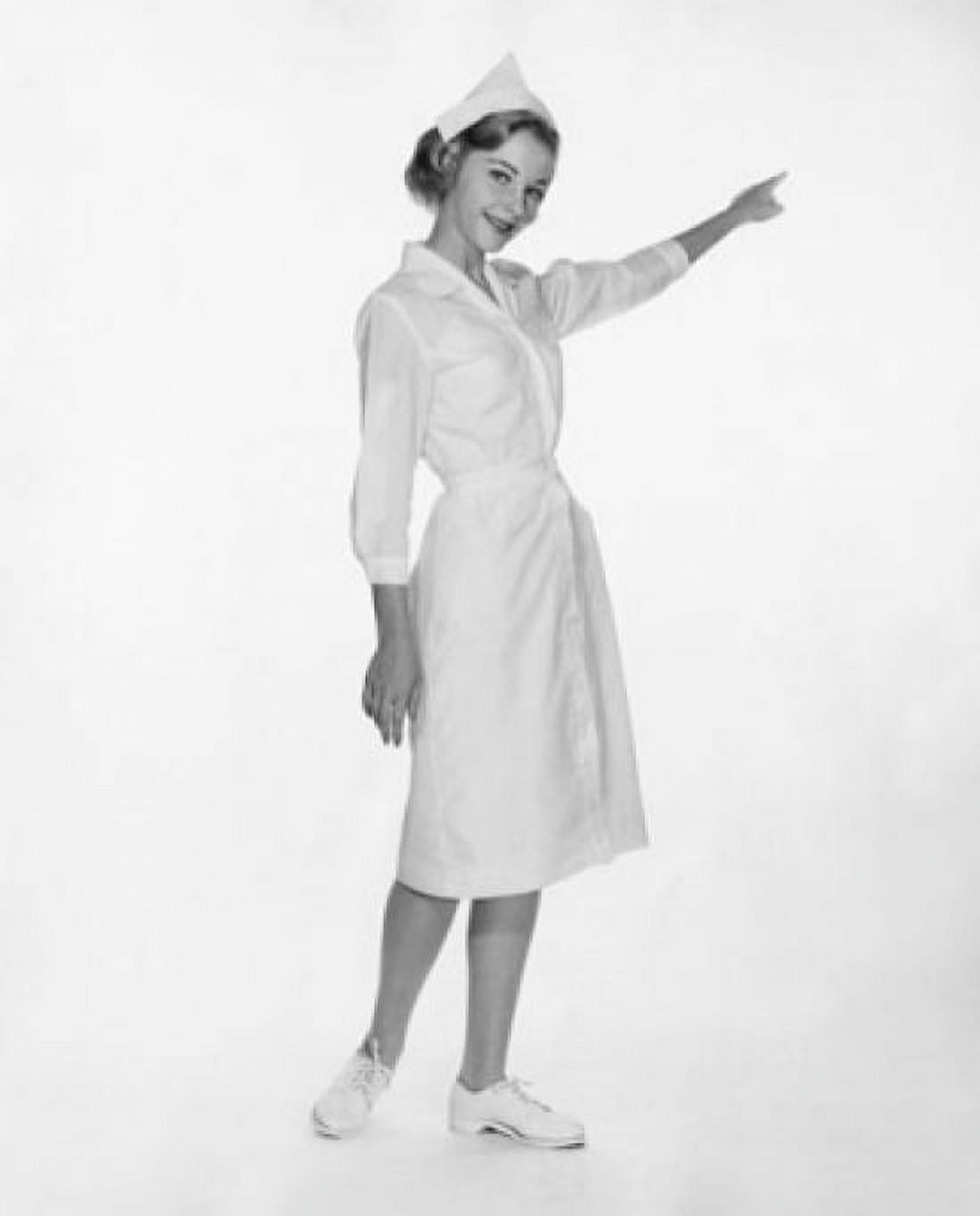 Portrait of a female nurse pointing with her finger Canvas Art - (24 x 36)