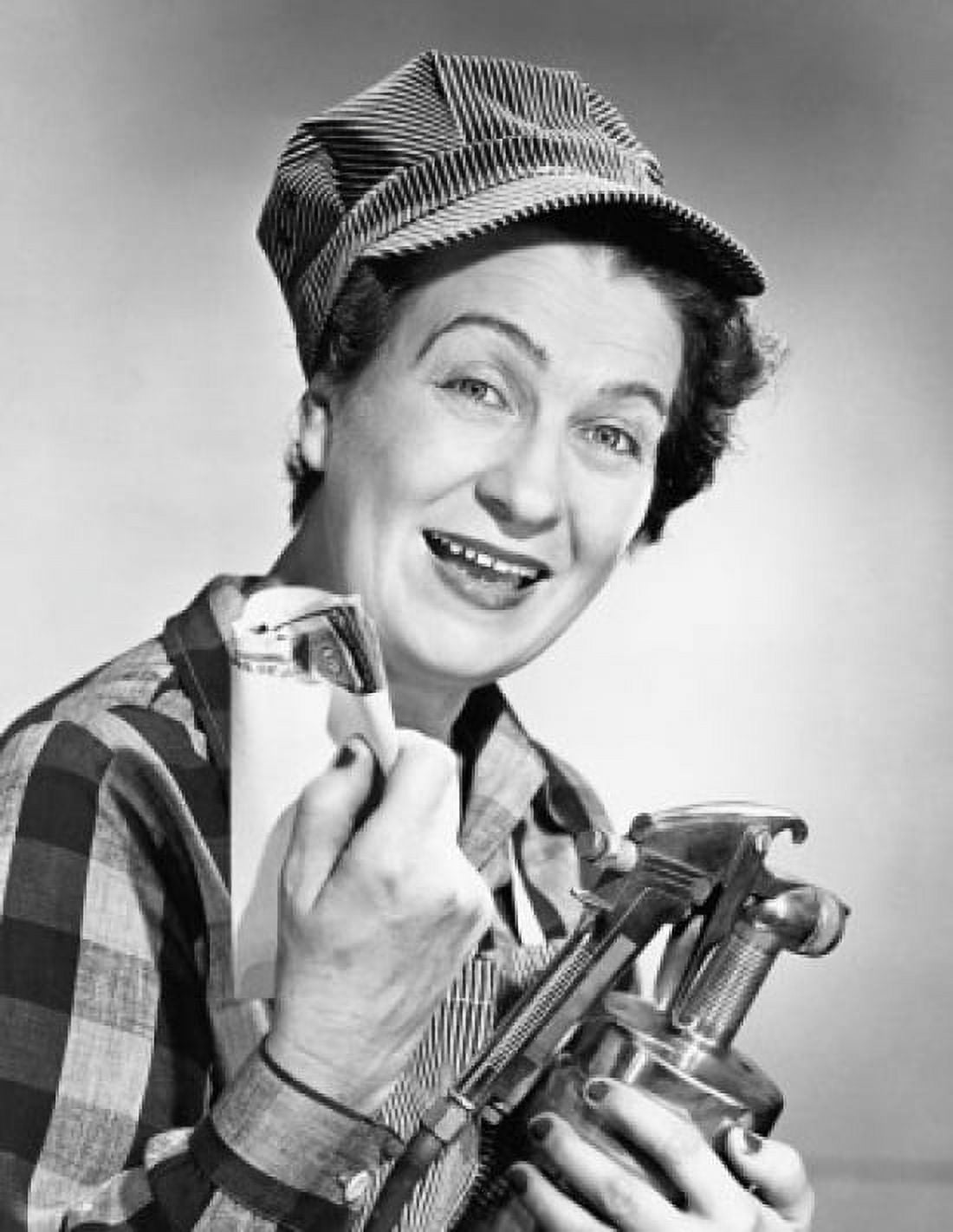 Portrait of a female painter holding a paint spray gun 1950 Canvas Art - (24 x 36)