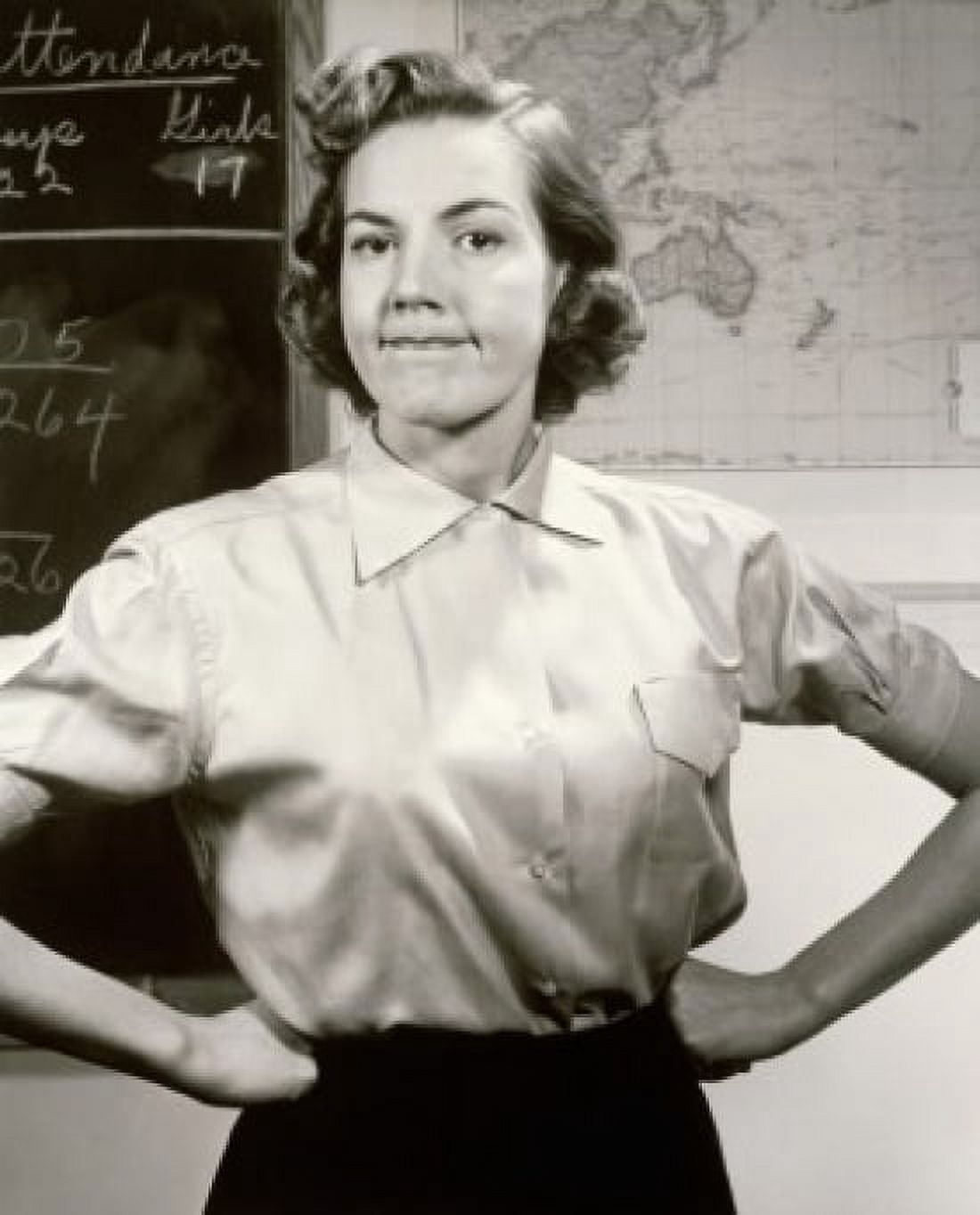 Portrait of a female teacher with arms akimbo in a classroom Canvas Art - (18 x 24)