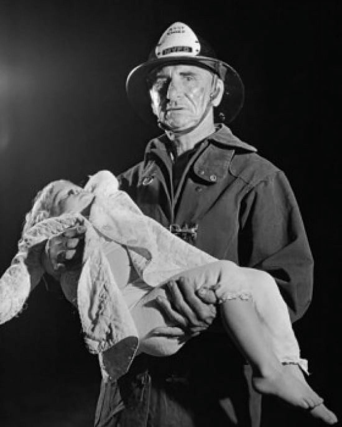 Portrait of a fireman carrying an injured child Canvas Art - (18 x 24)